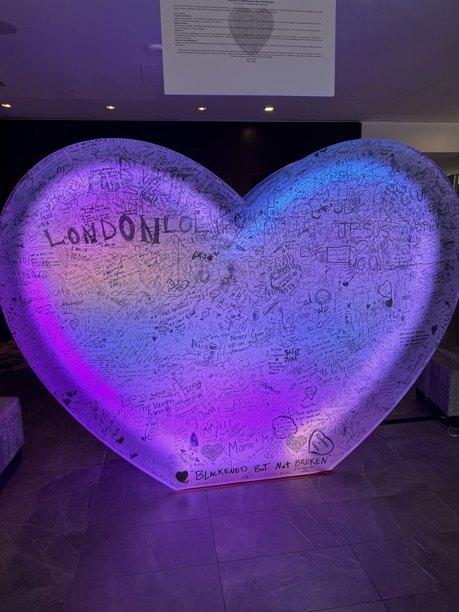 A giant glowing heart covered in handwritten messages